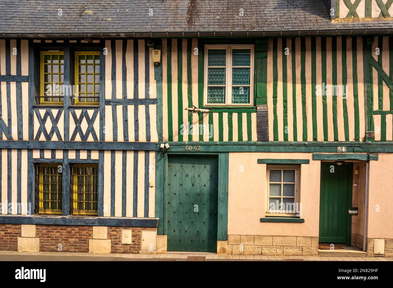 Tradtional medieval facades along the D 675 department road in Pont-l'Évêque, Normandy, France Stock Photo