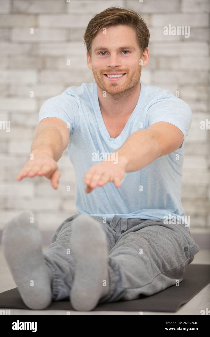 Handsome guy stretching muscles legs hi-res stock photography and ...