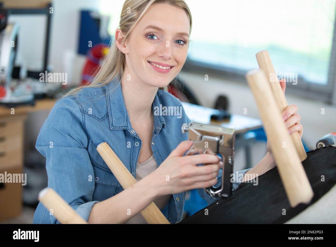 Woman upholstering chair hi-res stock photography and images - Alamy