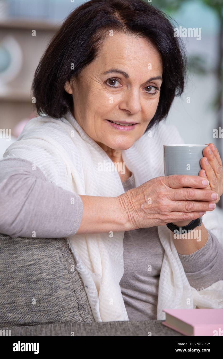 70-year-old-woman-at-home-drinking-tea-stock-photo-alamy