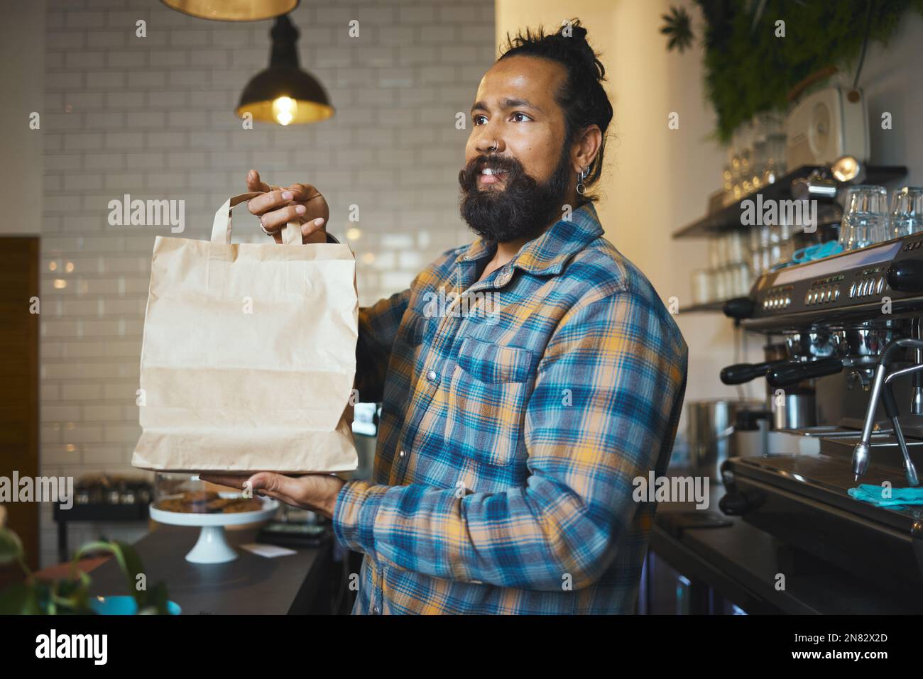 Cafe, takeaway bag and cashier man or small business owner with