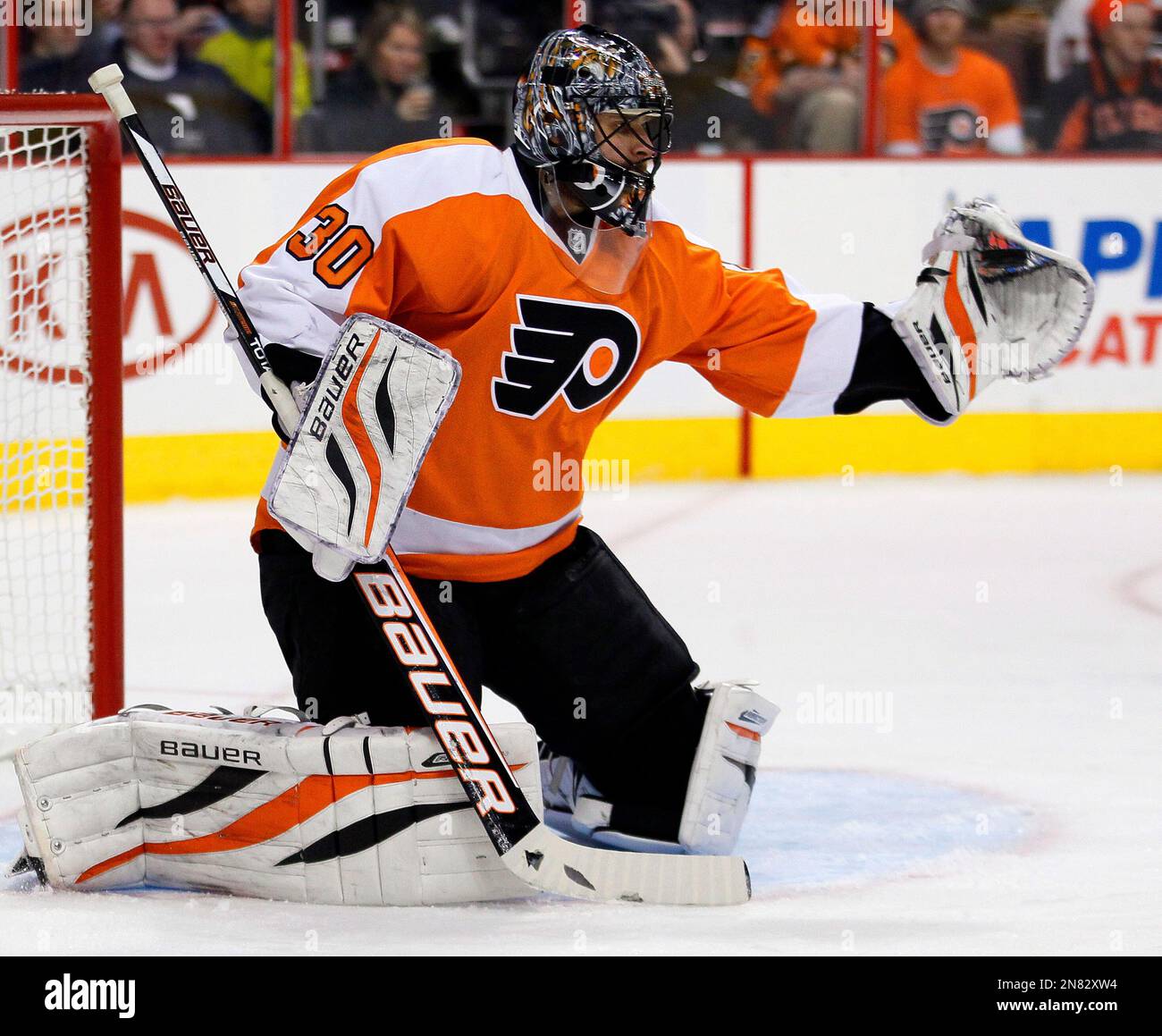 Philadelphia Flyers goalie Ilya Bryzgalov makes a glove save in the