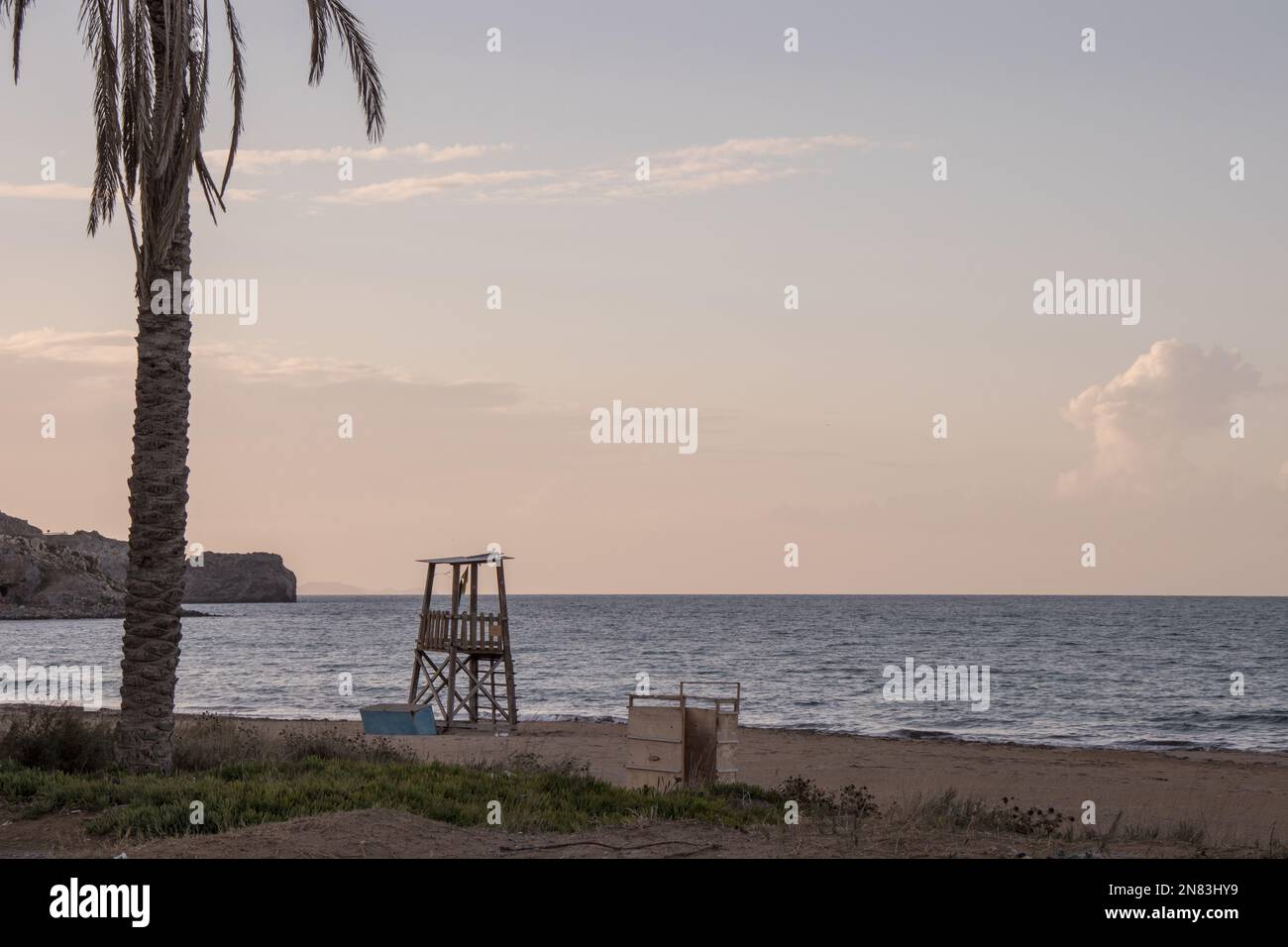 Lifeguard tower on a greek beach at sunset. Empty beach in winter Stock Photo