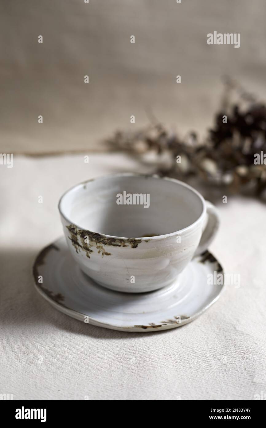 Handmade empty craft ceramic on  textile background. Stock Photo