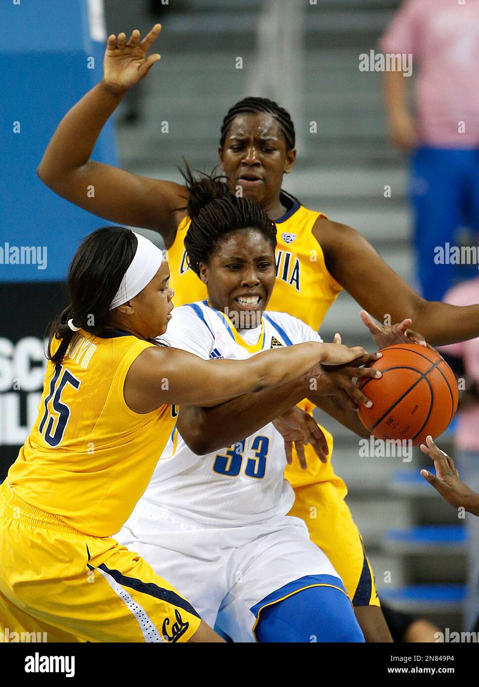 UCLA forward Jasmine Dixon, center, is defended by California guard ...