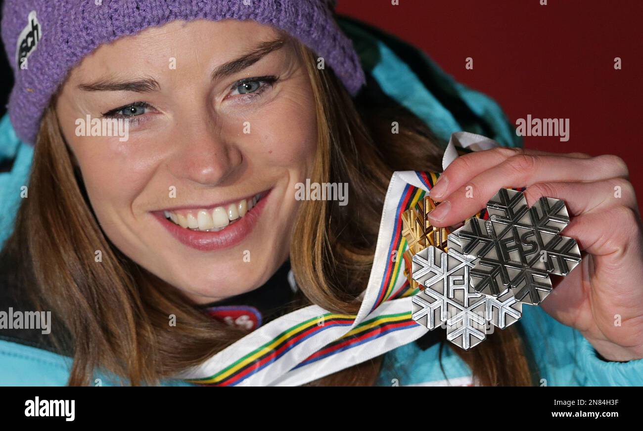 Slovenia's silver medal winner Tina Maze poses with her medals during