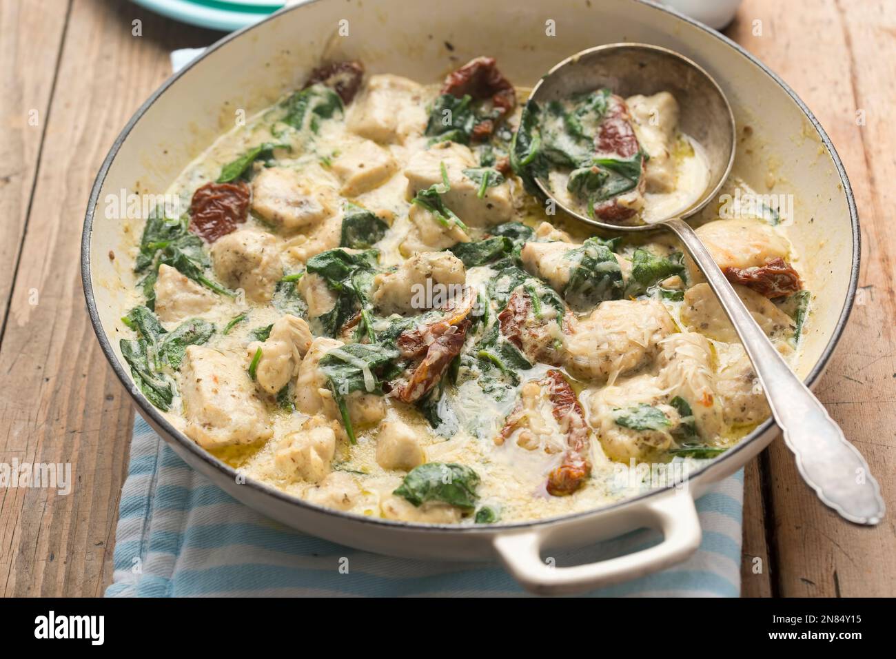 Creamy Tuscan chicken with sun dried tomatoes and spinach Stock Photo
