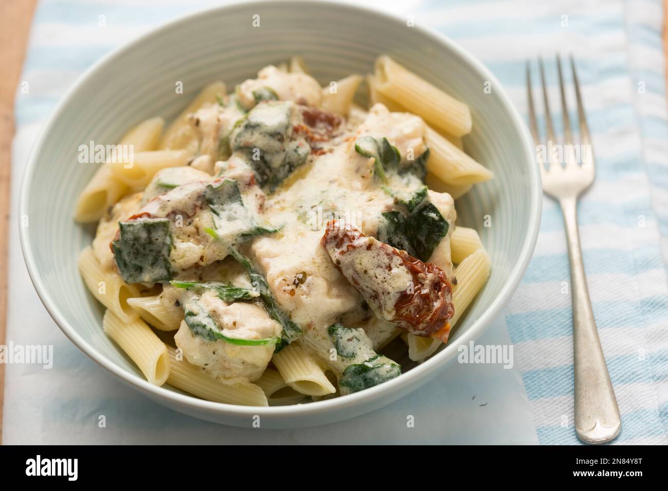Creamy Tuscan chicken with sun dried tomatoes and spinach Stock Photo
