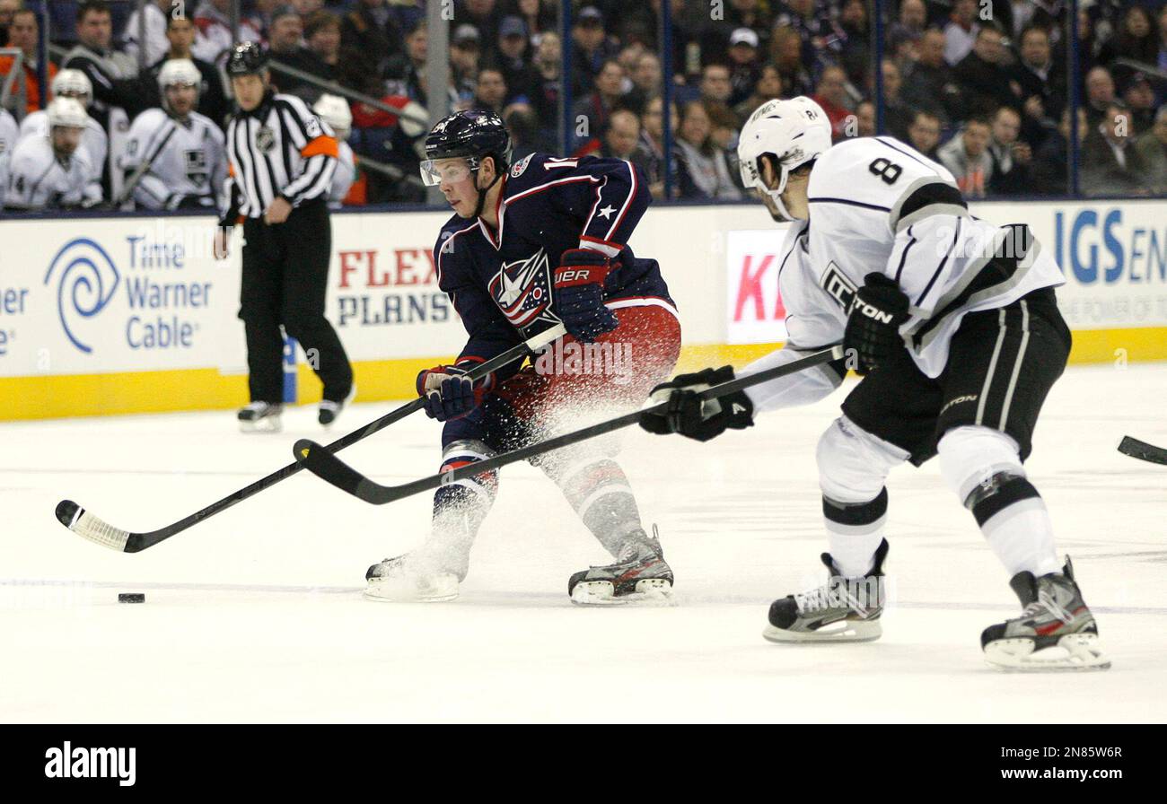 Columbus Blue Jackets' Ryan Johansen (19), left, prepares to shoot as