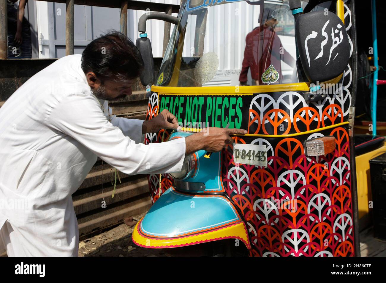 In this Saturday, Feb. 2, 2013 photo, Pakistani artist Nusrat Iqbal ...