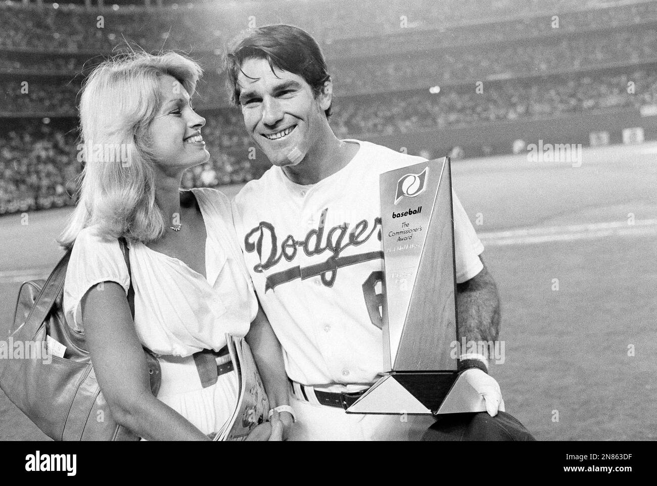 Steve Garvey poses with his wife Cyndy while holding his Most Valuable
