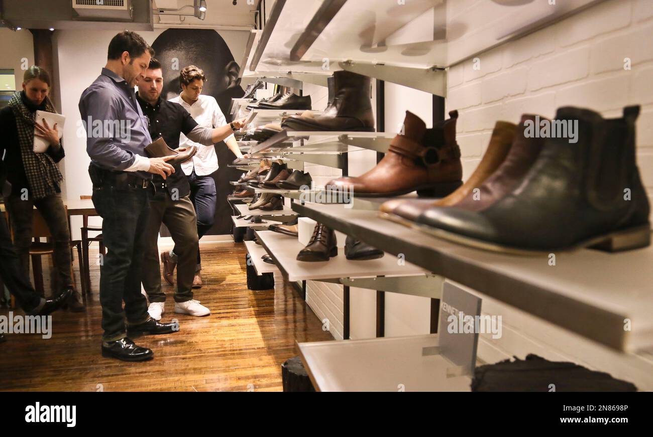 This Jan. 29 2013 photo shows designer Kenneth Cole second from