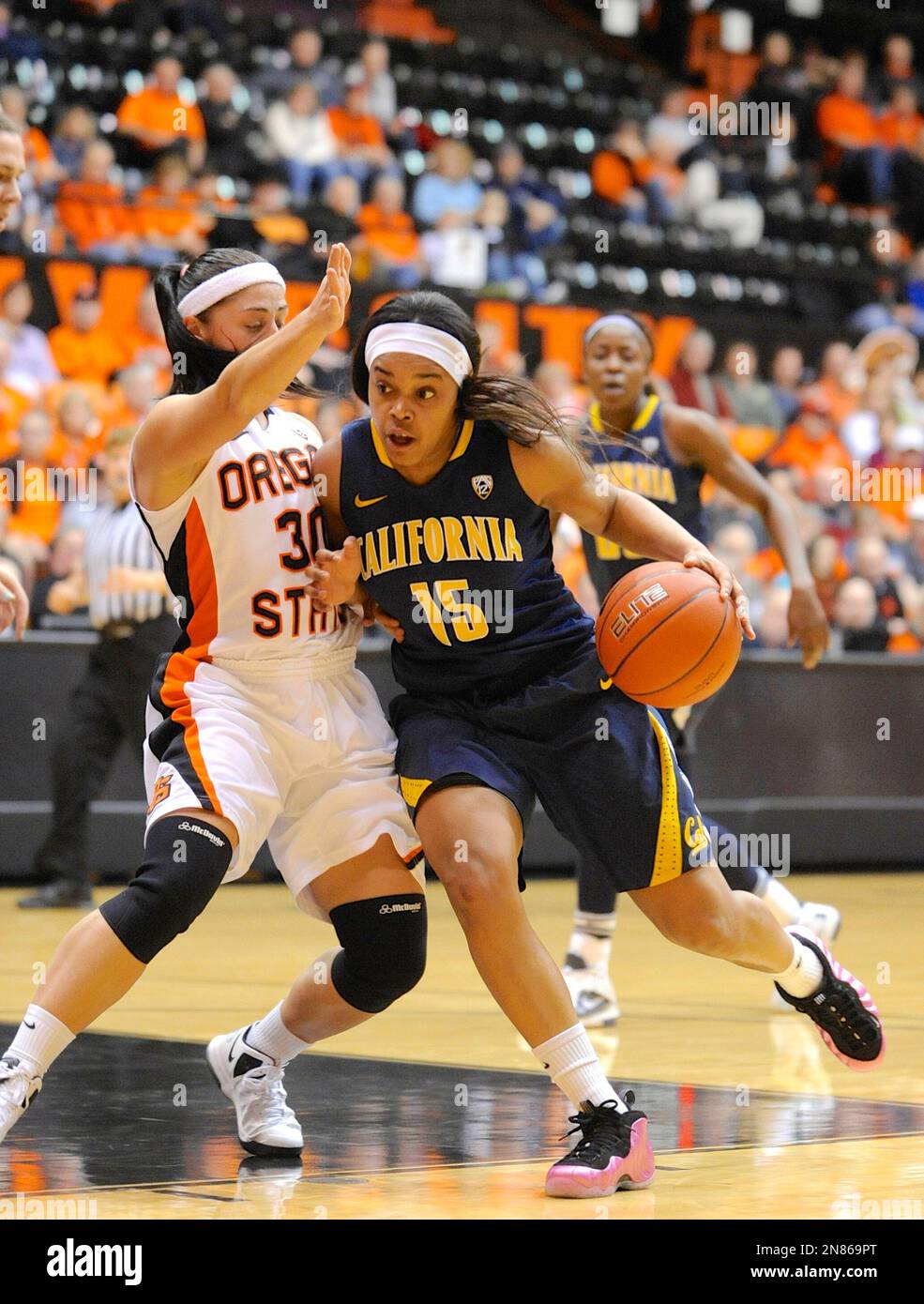 California's Brittany Boyd (15) drives against Oregon State's Mollee Schwegler (30) during an NCAA college women's basketball game in Corvallis, Ore., Friday, Feb.1, 2013. California beat Oregon State 60-38.(AP Photo/Greg Wahl-Stephens) Stock Photo