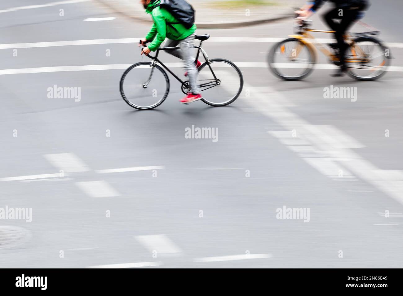 picture in camera made motion blur of bicycle riders crossing an ...
