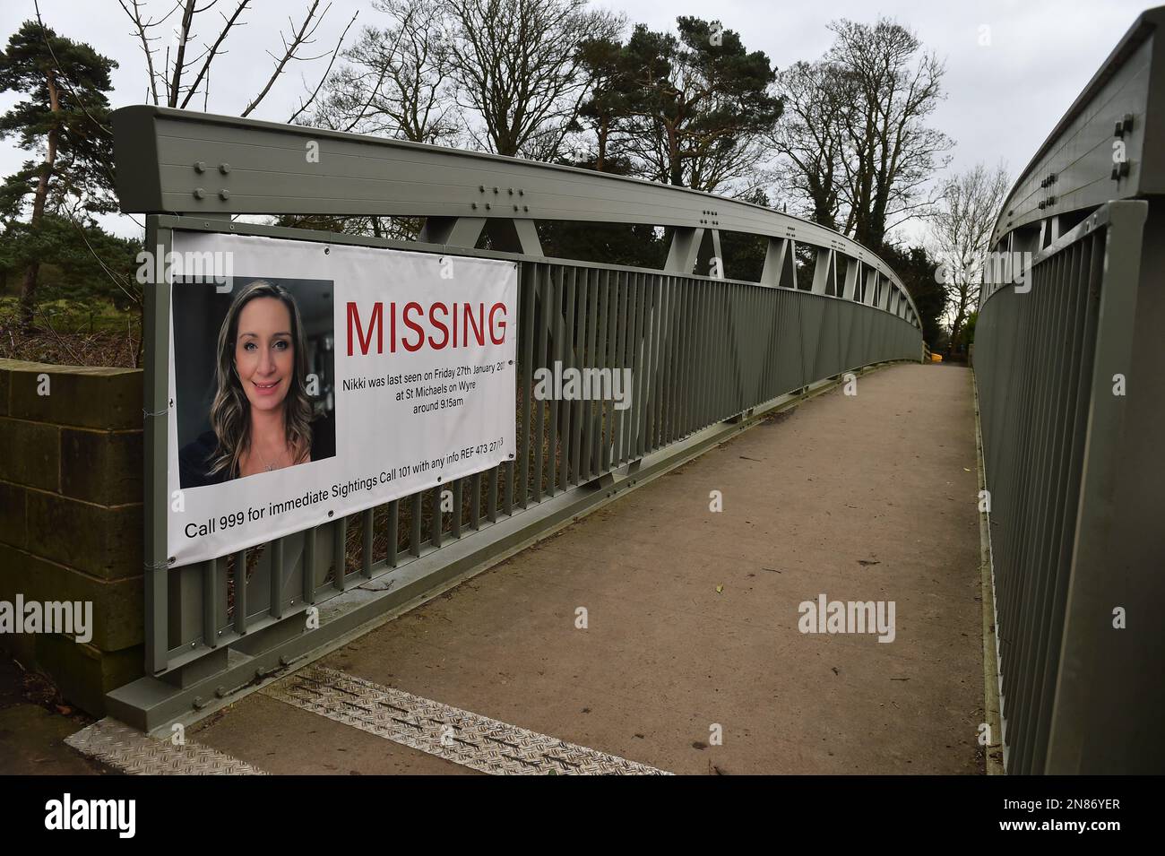 A missing person appeal poster for Nicola Bulley on a bridge crossing the River Wyre in St Michael's on Wyre, Lancashire, as police continue their search for Ms Bulley, 45, who was last seen on the morning of Friday January 27, when she was spotted walking her dog on a footpath by the river. Picture date: Saturday February 11, 2023. Stock Photo