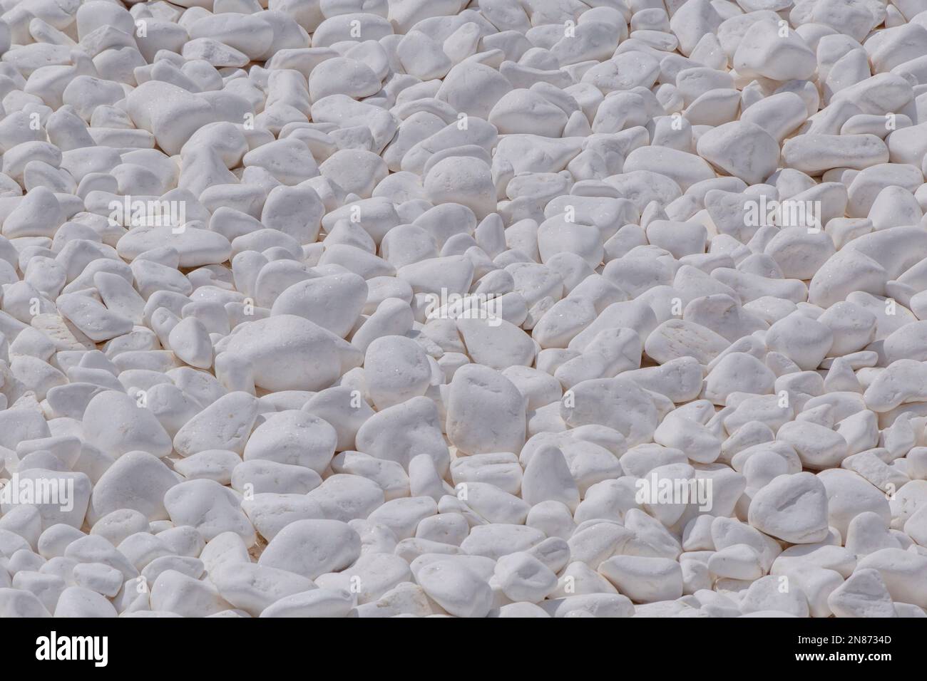 heap of whitewashed stones used as decoration on Santorini Stock Photo