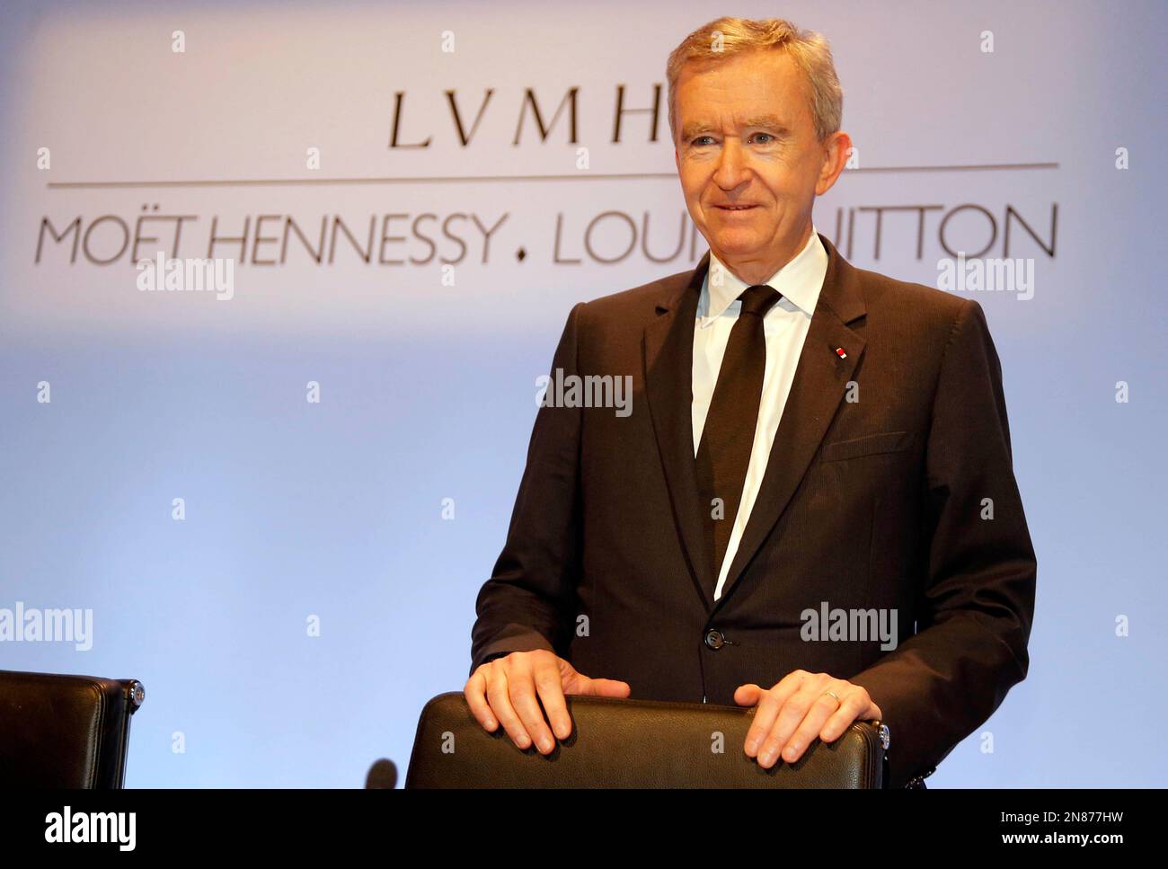 The chairman and CEO of the French conglomerate LVMH Moet Hennessy Louis  Vuitton SA Bernard Arnault (M) and his son Antoine Arnault (L) walks out  the Stock Photo - Alamy