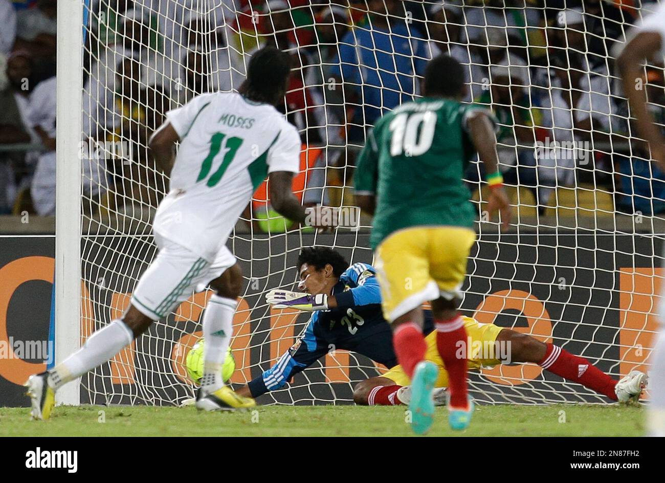 Nigeria's Victor Moses, left, shoots a penalty kick to score his second ...