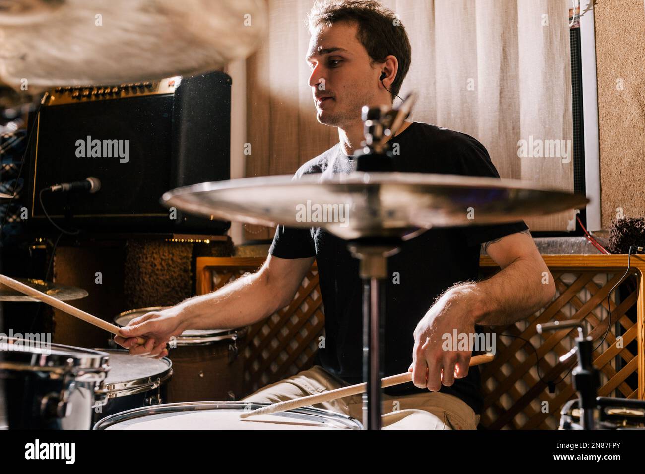Drummer rehearsing on drums before rock concert Stock Photo - Alamy