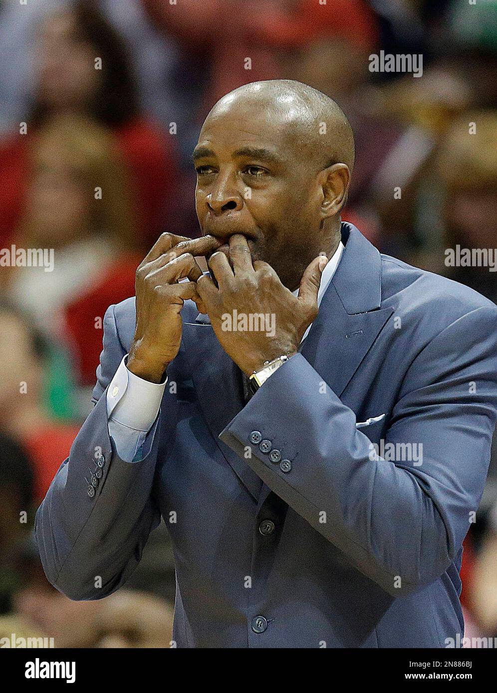 Atlanta Hawks head coach Larry Drew signals to his players during the