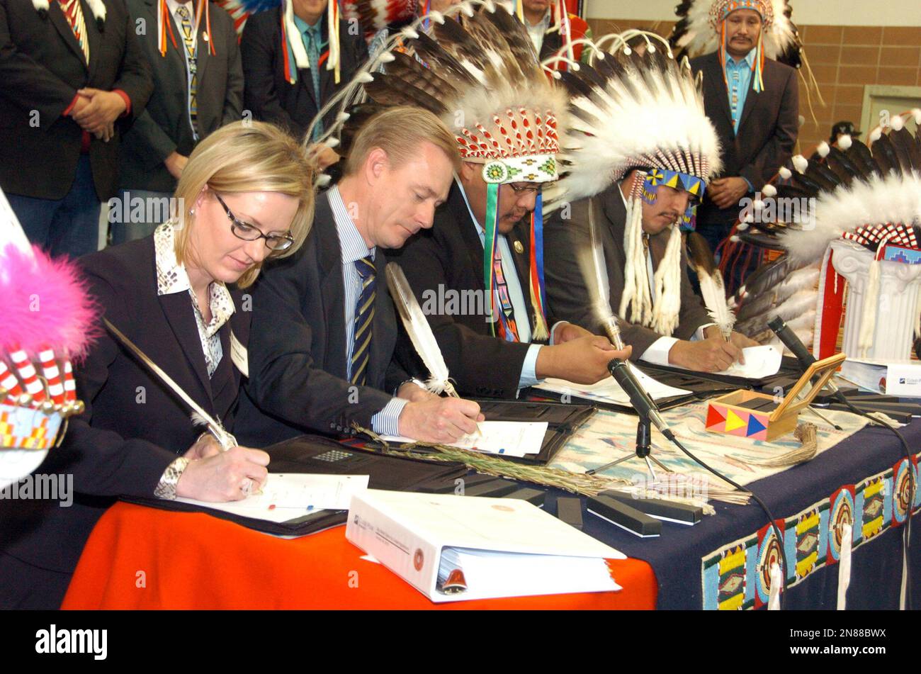 Representatives of Cloud Peak Energy and Montana's Crow Tribe sign an