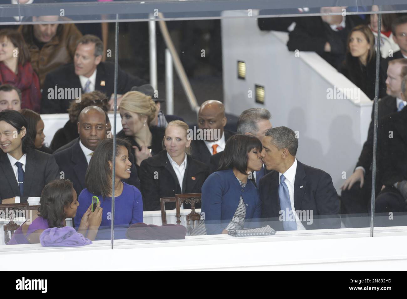 President Barack Obama kisses first lady Michelle Obama as their