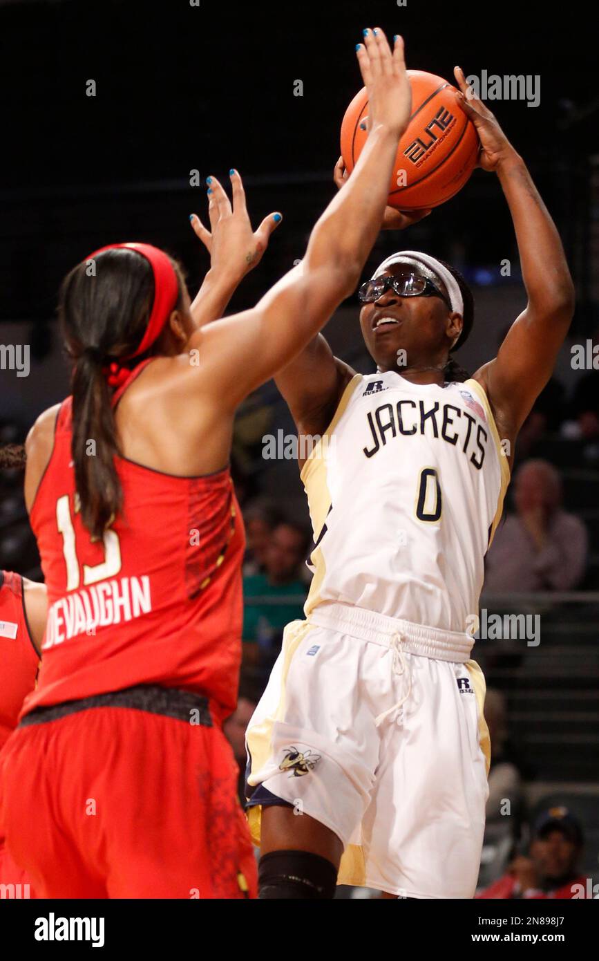 Tech guard Brittany Jackson (0) shoots over Maryland center