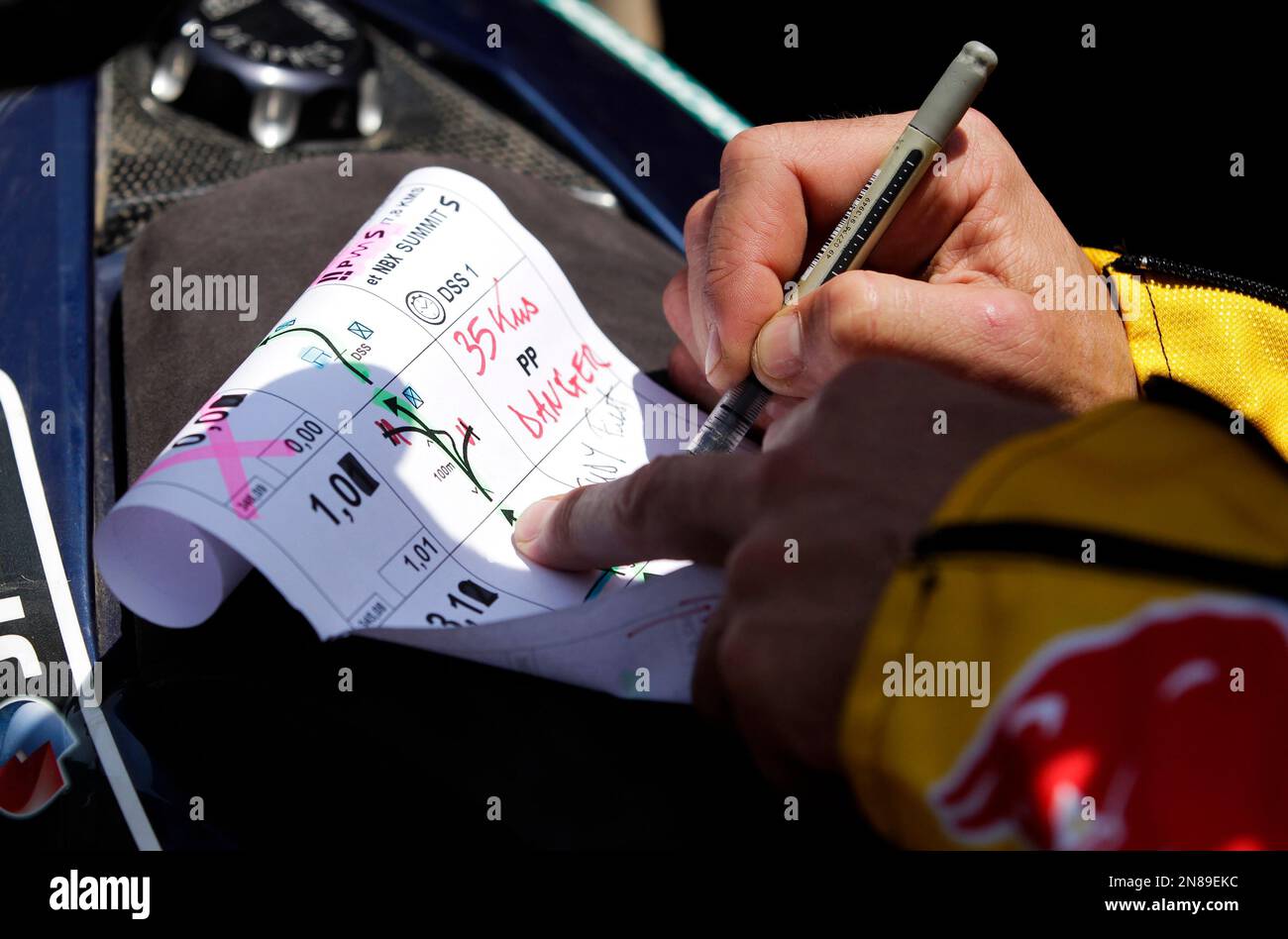 KTM rider Cyril Despres of France signs his road book after winning the 2013  Dakar Rally in the motorcycle category at the end of the 14th stage from La  Serena to Santiago,, image size:1300x948