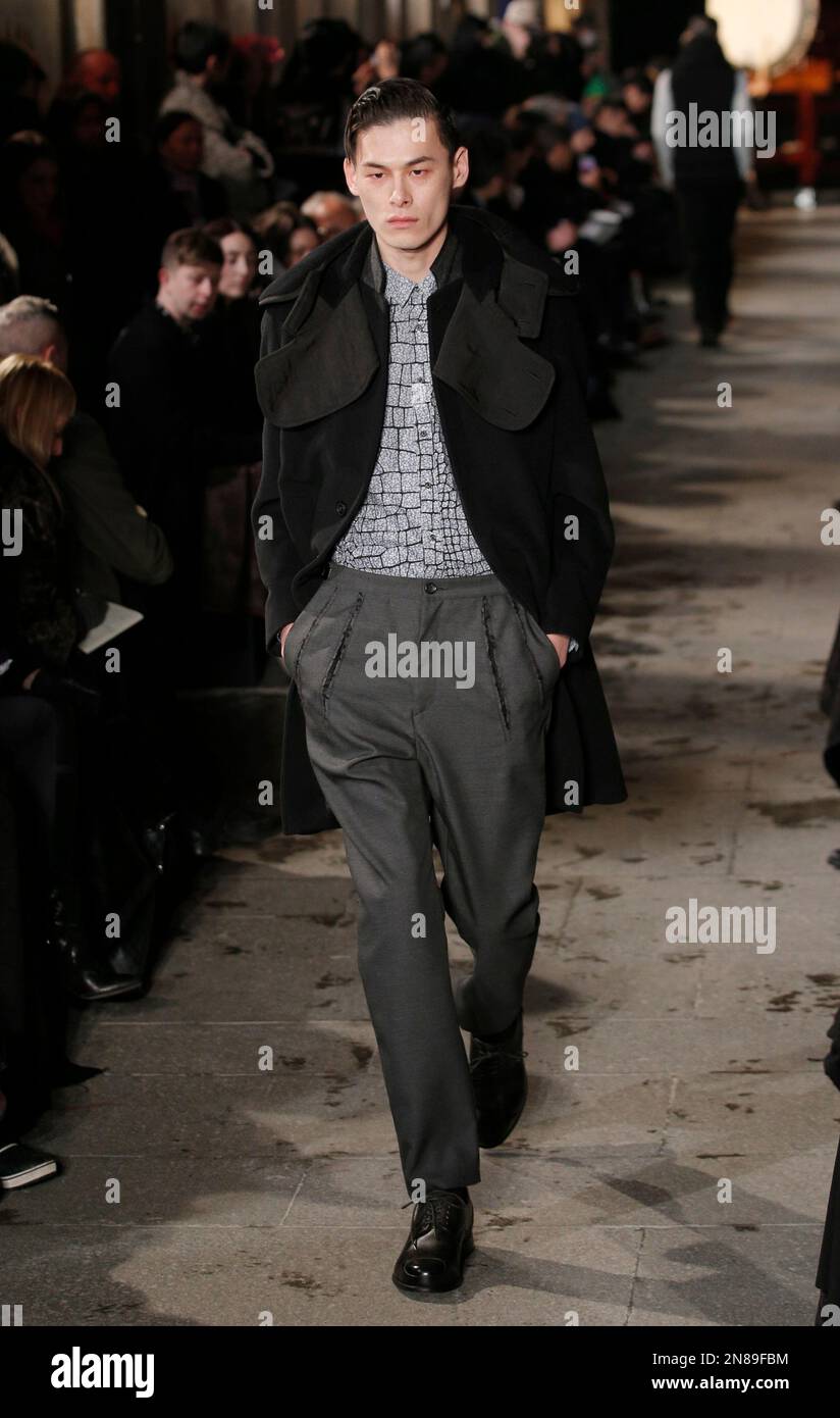 A model wears a creation by Japanese fashion designer Mihara Yasuhiro for  his fall-winter 2013/2014 men's fashion collection, presented in Paris,  Saturday, Jan. 19, 2013. (AP Photo/Christophe Ena Stock Photo - Alamy, image size:824x1390