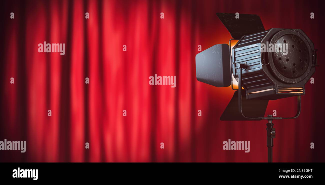 Stage or studio spotlight on red curtain background. Lighting equipment