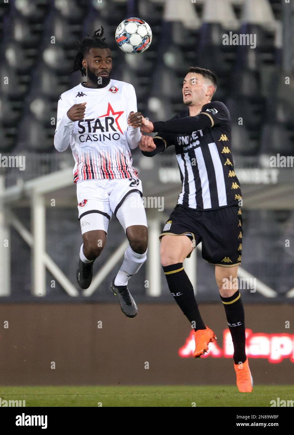 Seraings Junior Mansoni Sambu and Charlerois Stefan Knezevic fight for the ball during a soccer match between Sporting Charleroi and RFC Seraing, Saturday 11 February 2023 in Charleroi, on day 25 of
