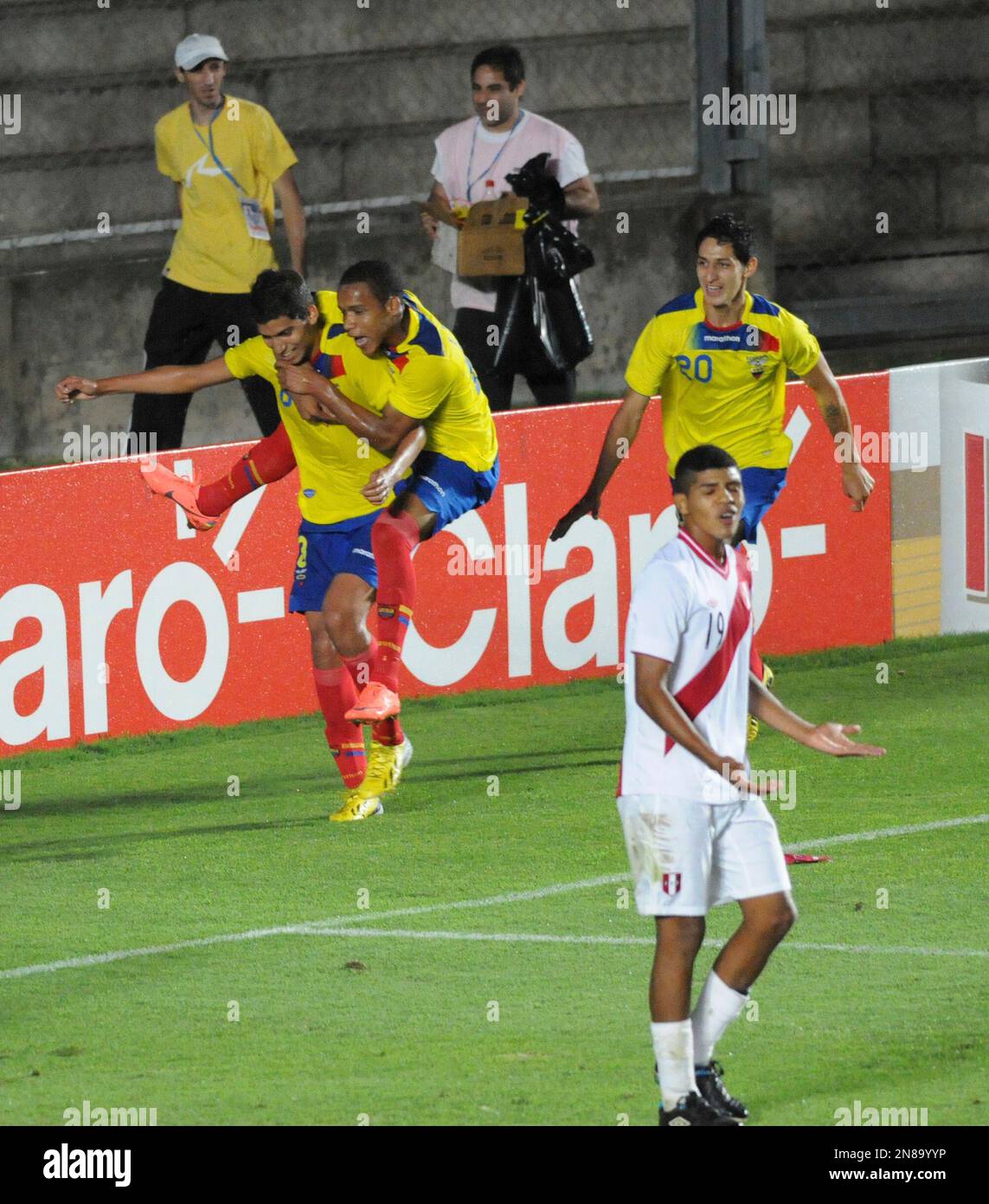 Ecuador's Jose Cevallos, left, celebrates with teammates after scoring 