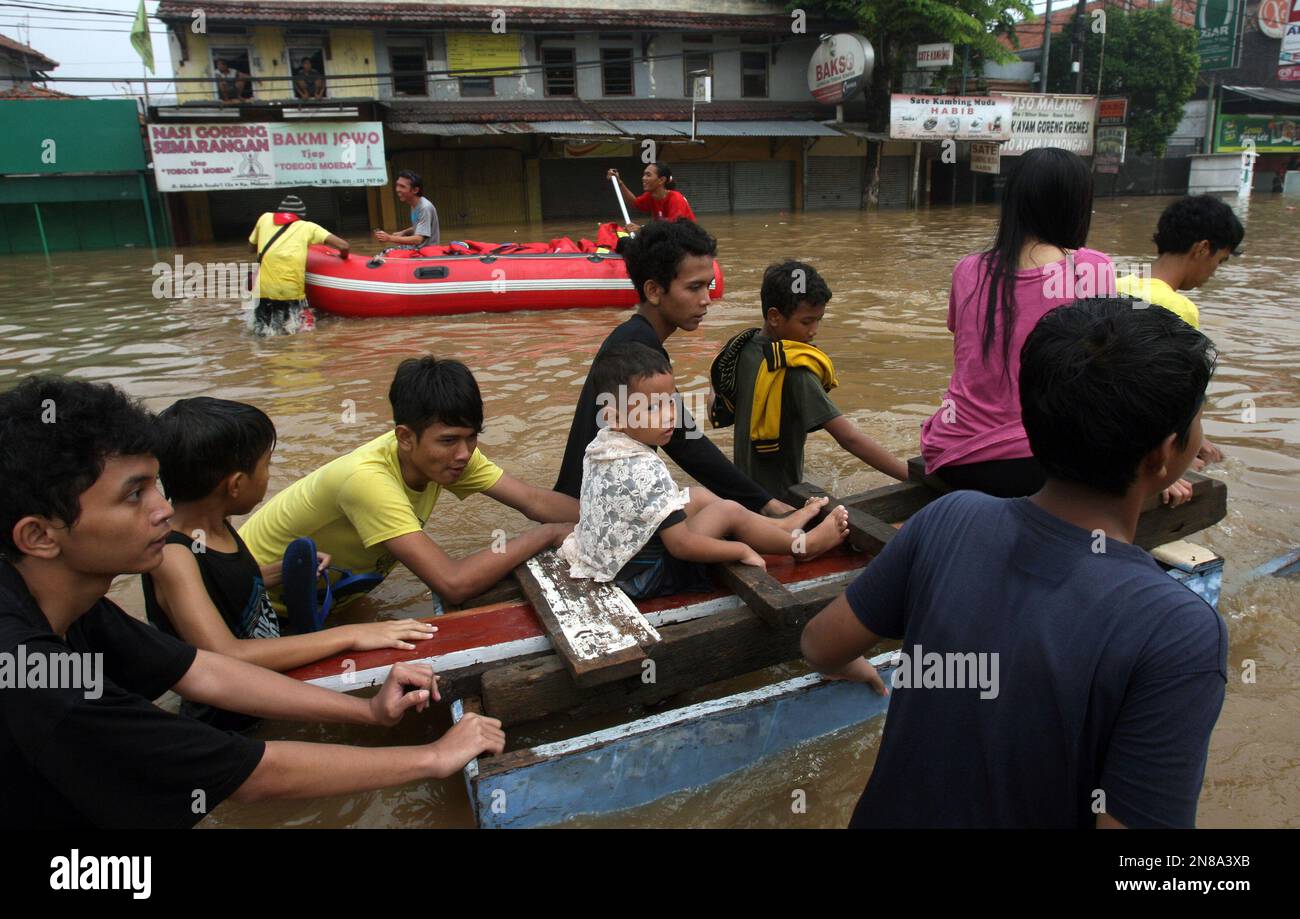 Indonesians Wade Through Floodwaters In Jakarta Indonesia Wednesday