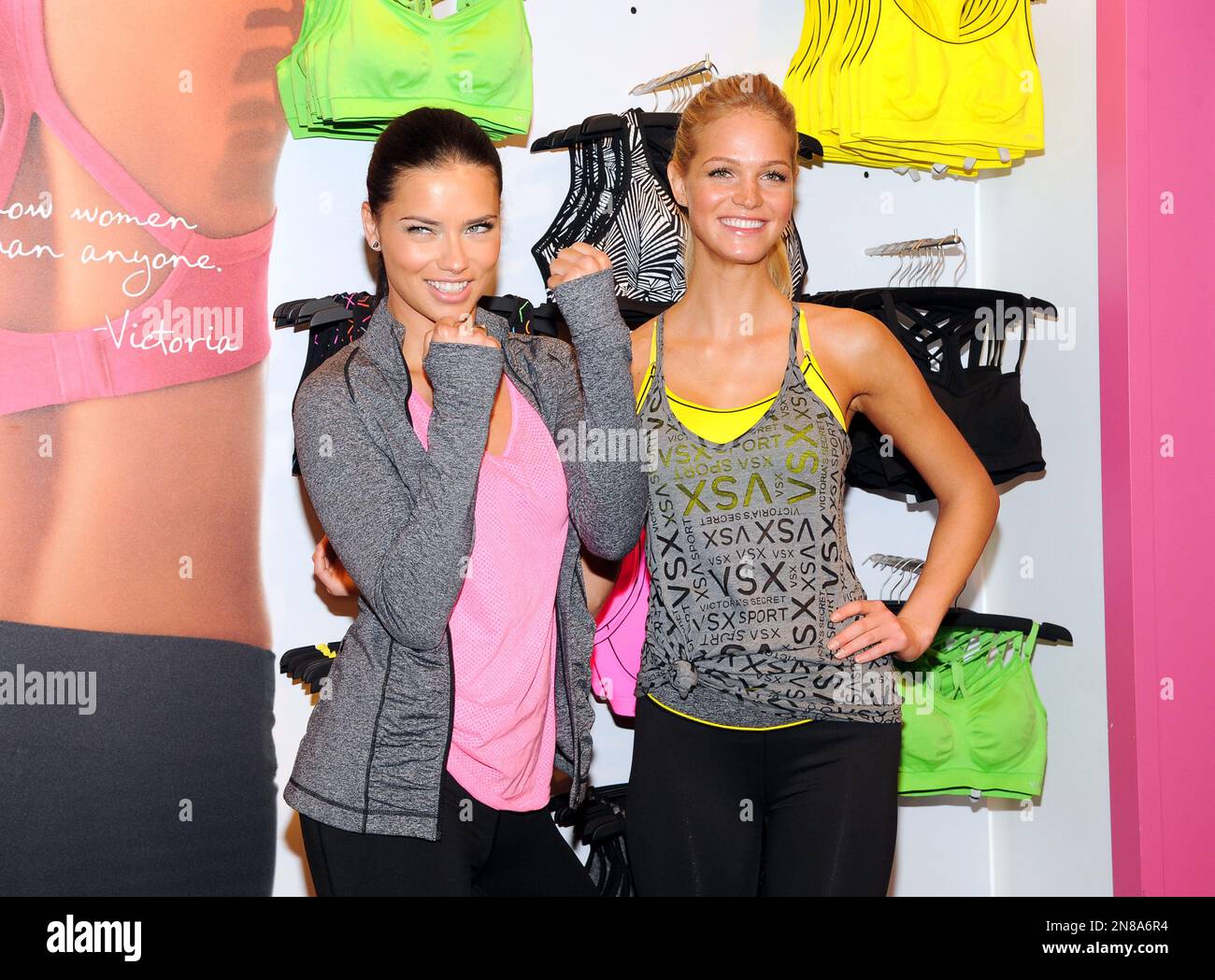 Models Adriana Lima, left, and Erin Heatherton pose together at a Victoria's  Secret VSX Sport Collection launch event at the Victoria's Secret Herald  Square store on Tuesday, Jan. 15, 2013 in New