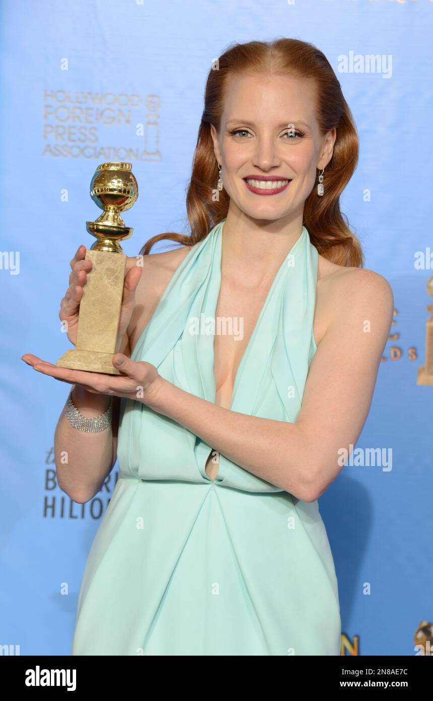 Actress Jessica Chastain poses with the award for best performance by ...