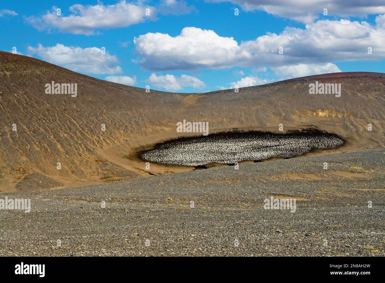 Barren dry volcanic hill with stain dirty ice rest - Grábrók Area, Iceland Highlands Stock Photo