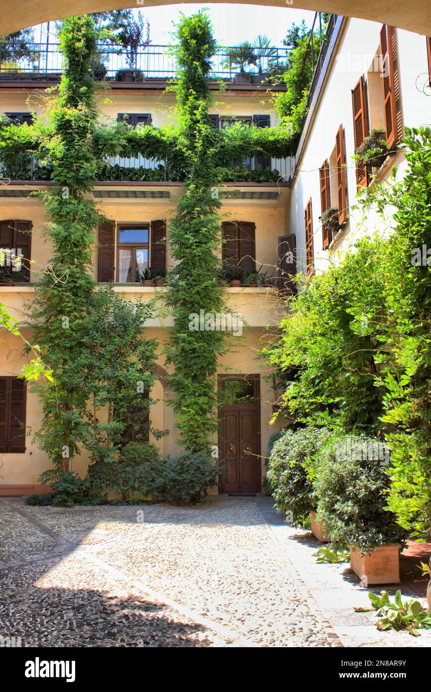 Picturesque courtyard with plants in Verona, Italy Stock Photo