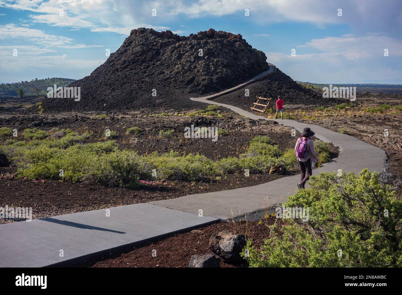 Craters of the Moon National Monument and Preserve near Arco, Idaho is a large ocean of lava flows with scattered islands of cinder cones and sagebrus Stock Photo
