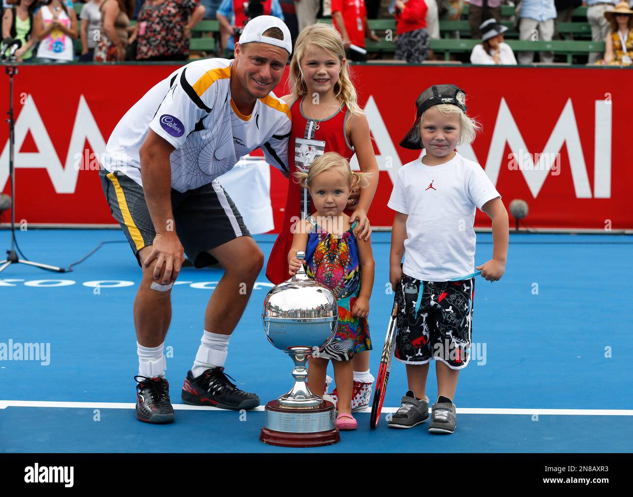 Australia's Lleyton Hewitt holds poses with his children, Mia, Ava