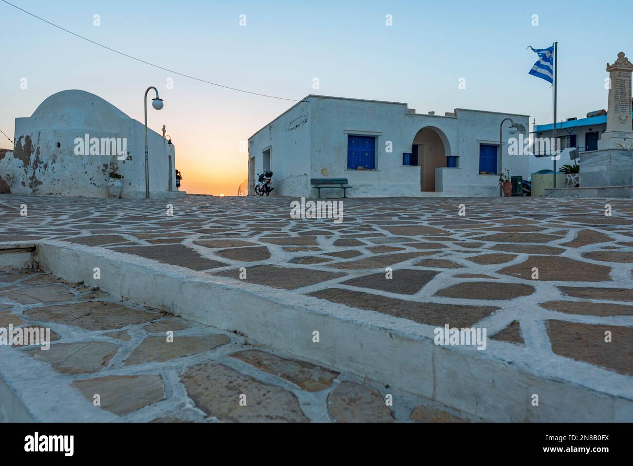 The sunset seen from the main square of Chora village, Anafi Stock Photo