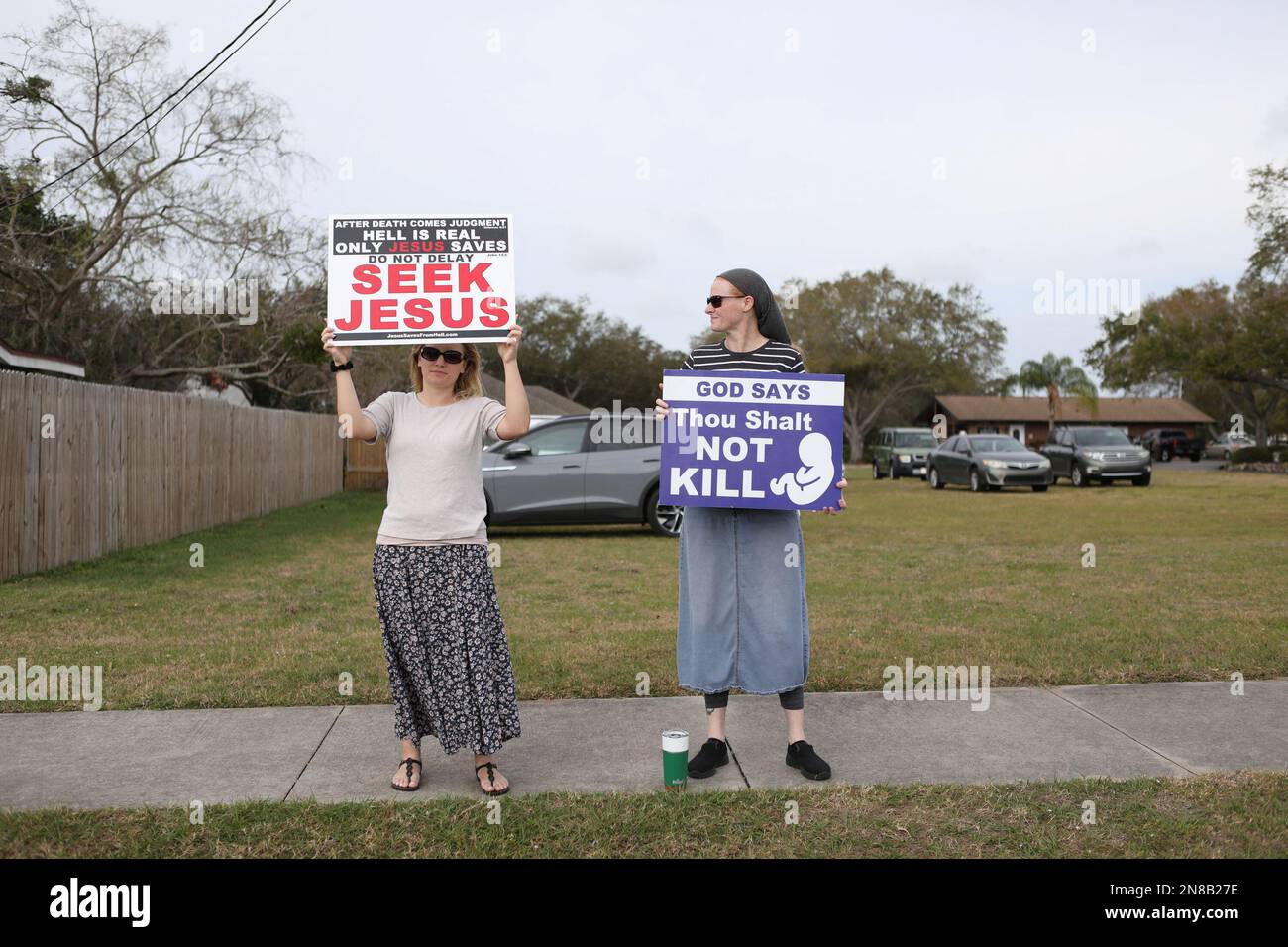 Jessie DePalmer (L) and Spring Siders who are members of the King James Version Baptist Church, also anti-abortion activist protest patients arriving outside of Bread and Roses Woman's Health Center, a clinic that provides abortions in Clearwater, Florida, U.S. February 11, 2023.  REUTERS/Octavio Jones Stock Photo