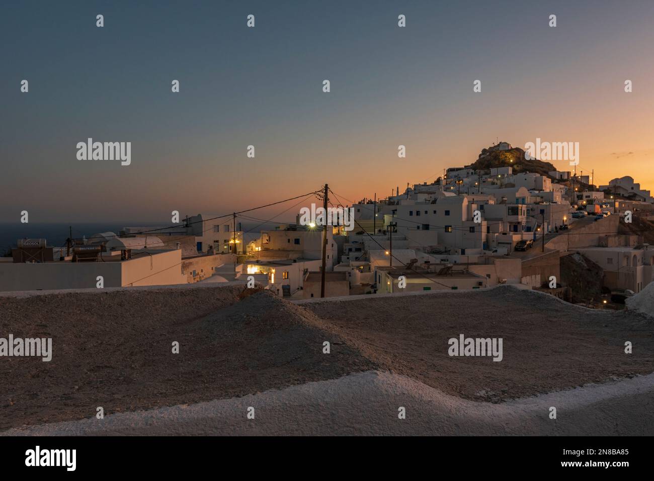 View of Chora village at dusk, Anafi Stock Photo