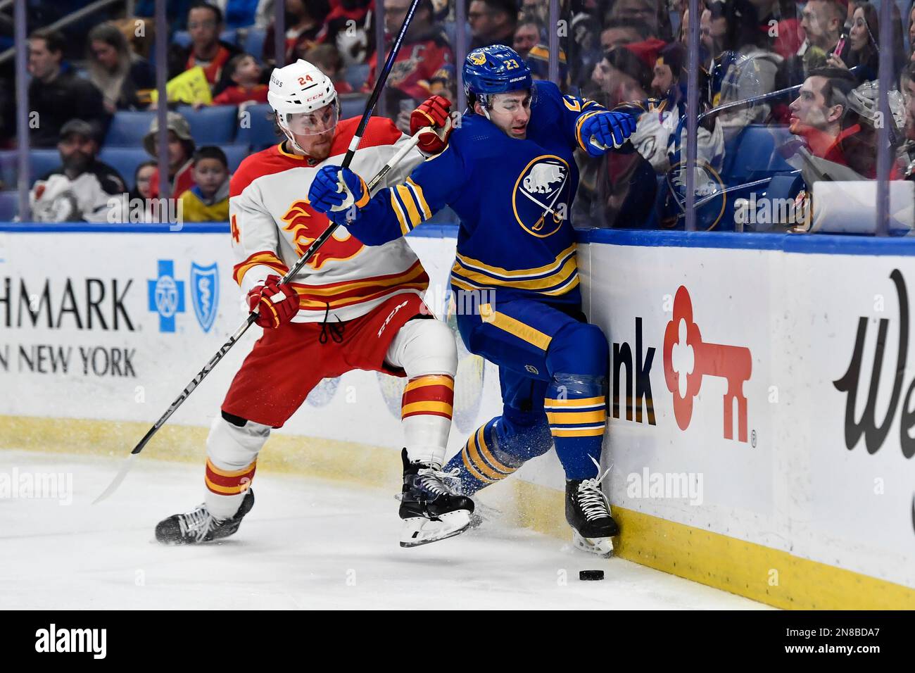 Buffalo Sabres defenseman Mattias Samuelsson, right, and Calgary Flames ...