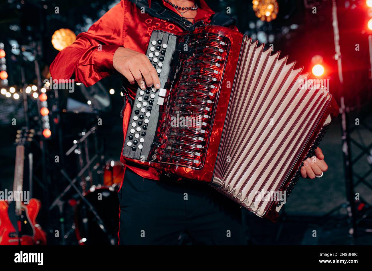 The musician plays the accordion. A hand plays the accordion closeup. Accordionist. Accordion