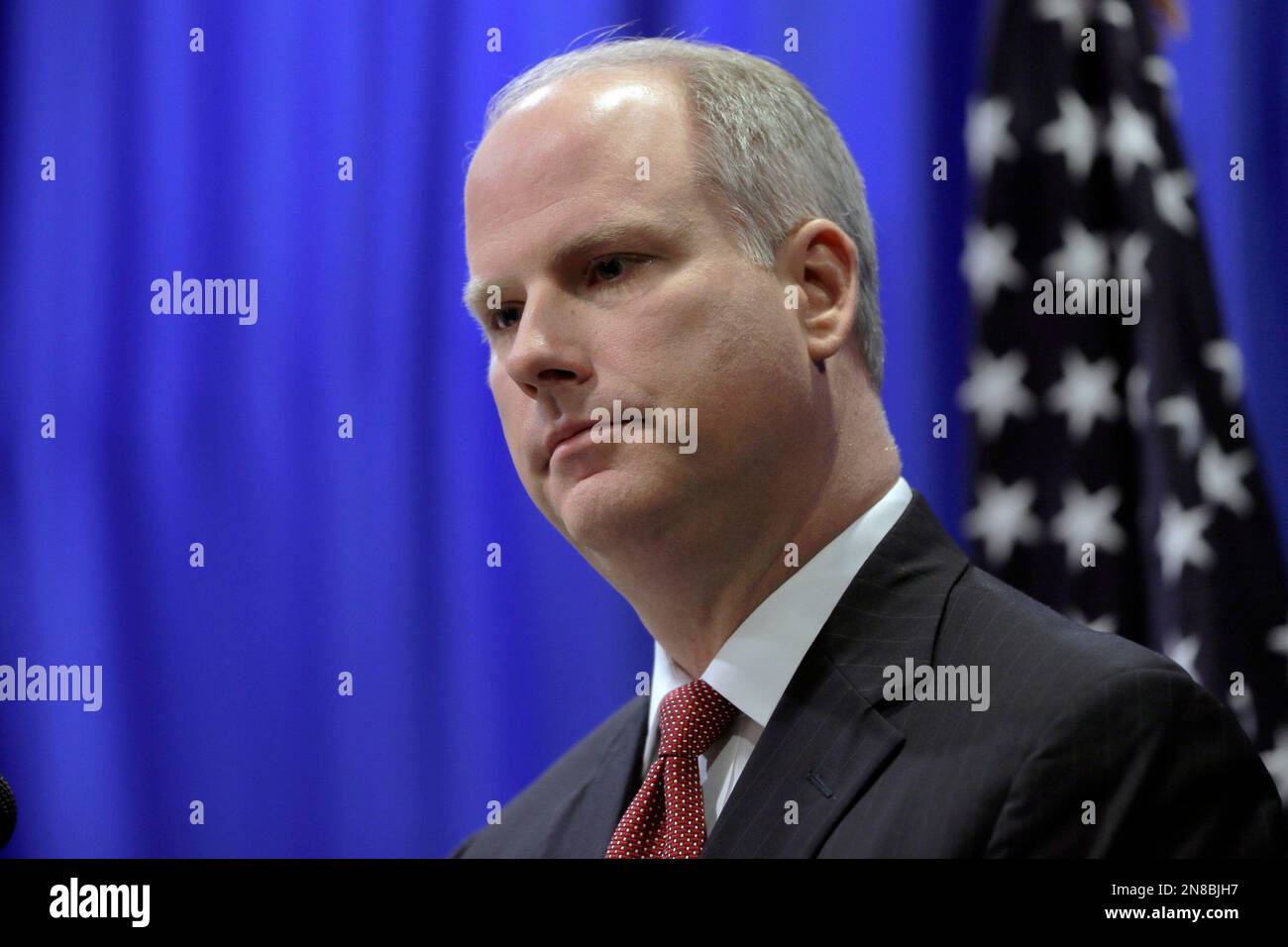 Arkansas Attorney General Dustin McDaniel listens to a reporter's ...