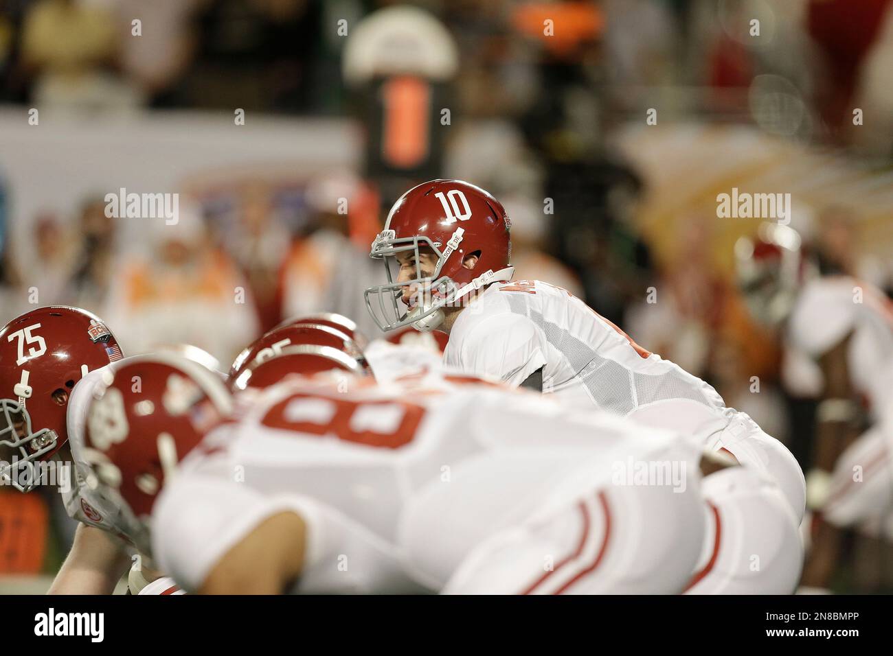 Alabama quarterback AJ McCarron (10) works against Notre Dame during the first half of the BCS National Championship college football game Monday, Jan. 7, 2013, in Miami. (AP Photo/Chris O'Meara) Stock Photo