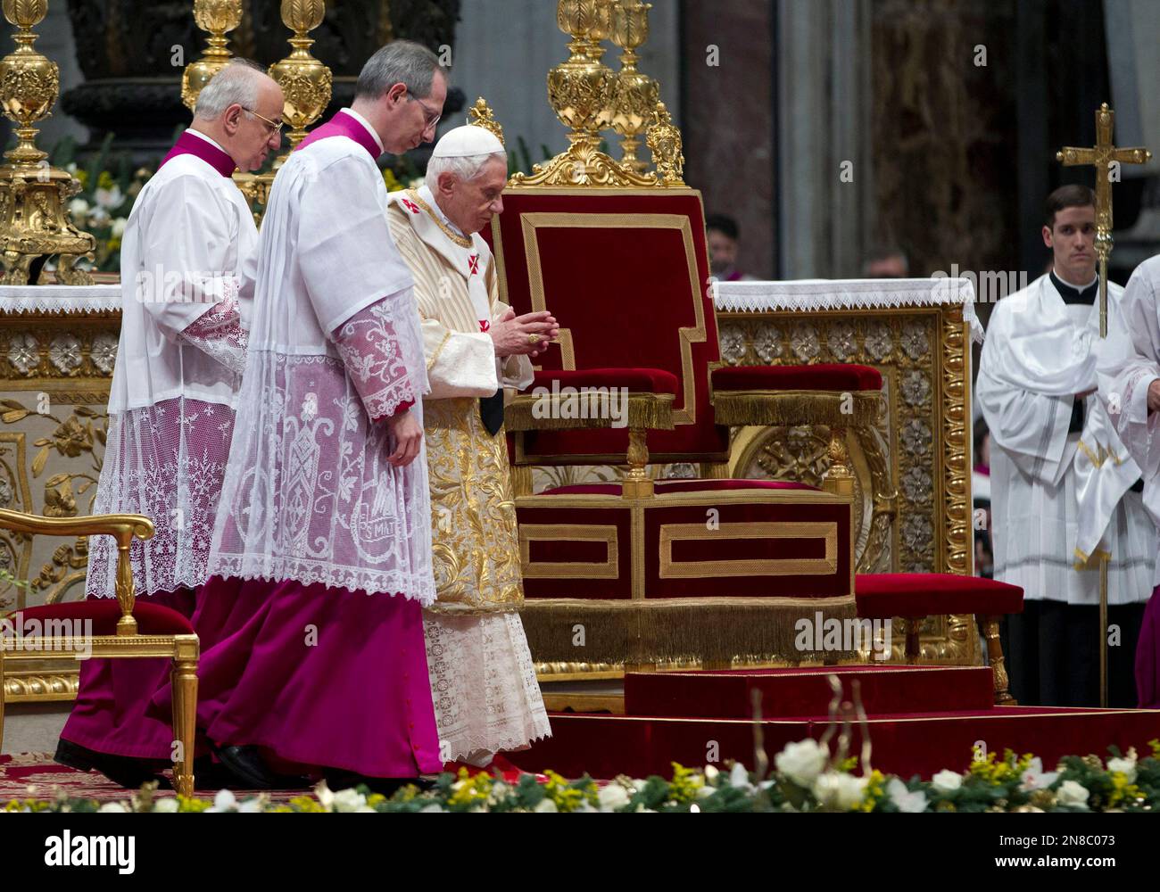 Pope Benedict XVI, third left, arrives to celebrate an Epiphany Mass in ...