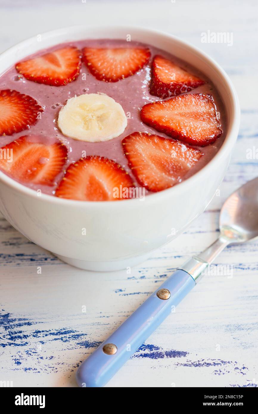 Mixed Berry Smoothie Bowl with strawberries and banana Stock Photo