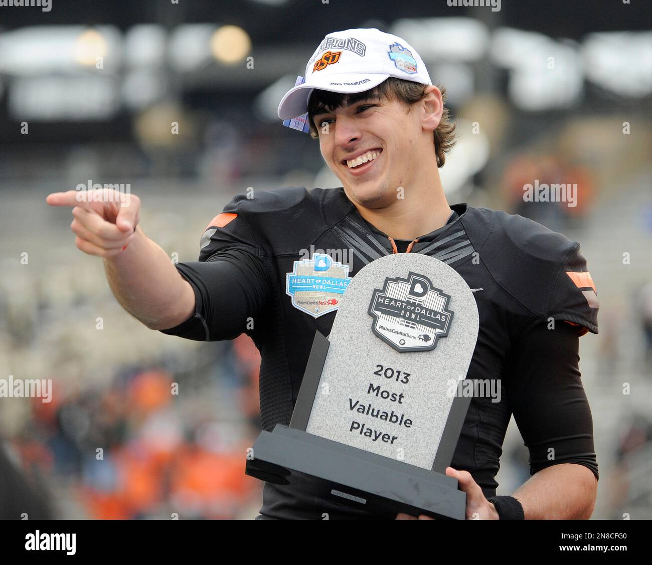 Oklahoma State quarterback Clint Chelf with the MVP trophy from the