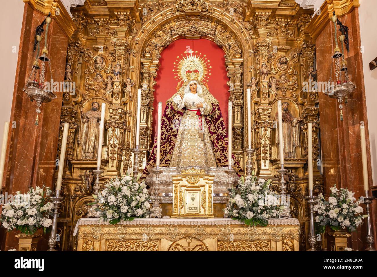 Seville, Spain - January 4, 2023: Image of the Virgen de la Esperanza de Triana inside the Capilla de los Marineros (Chapel of the Sailors) in the Tri Stock Photo